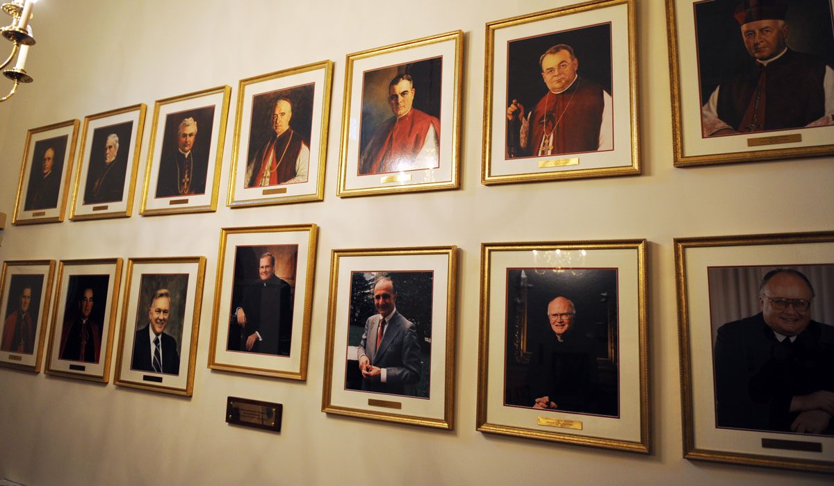 Wall of the portraits of all the CUA past presidents